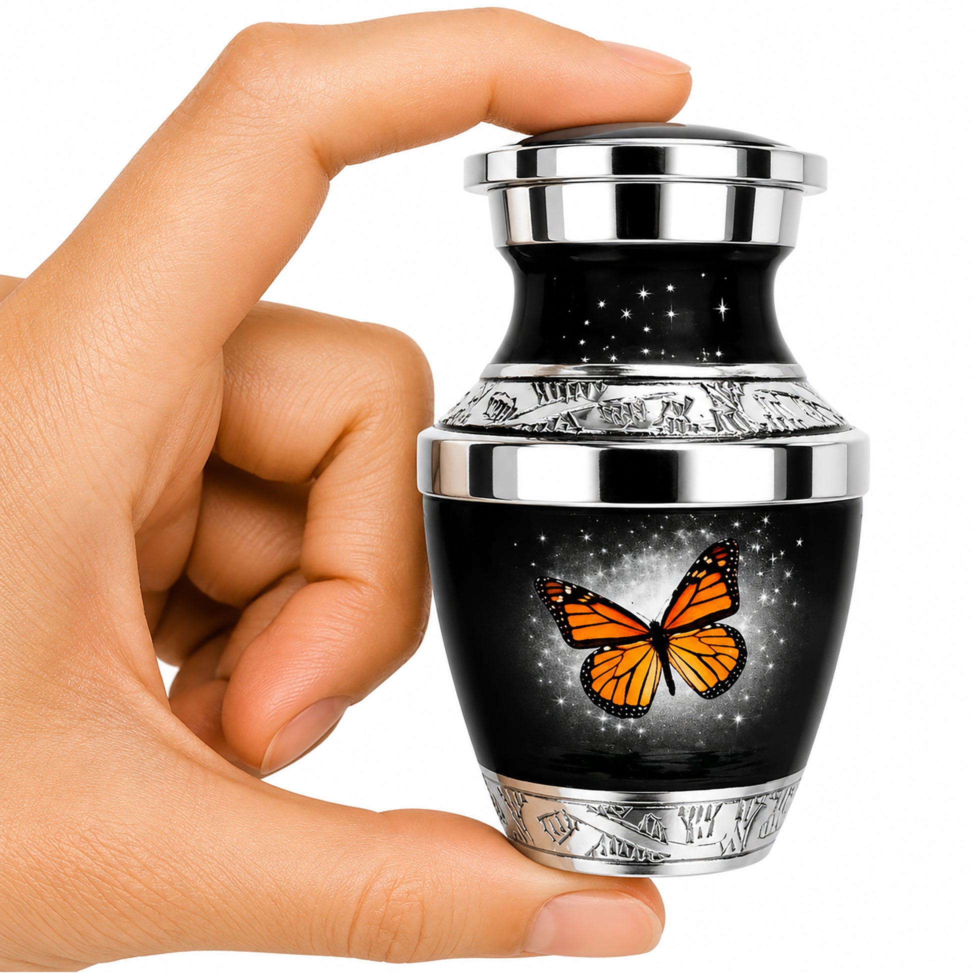 Black Monarch Butterfly Keepsake Cremation Urn held in hand — small sharing memorial urn for human ashes