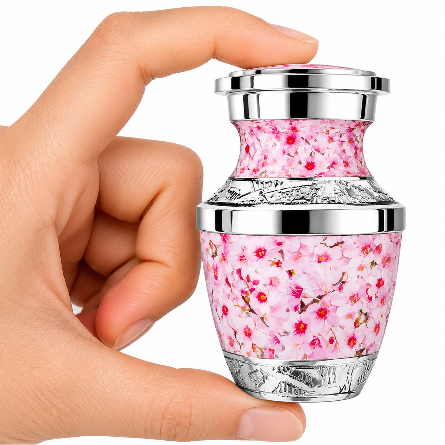 Pink Cherry Blossom Keepsake Cremation Urn held in hand with black velvet bag — small sharing memorial urn for women