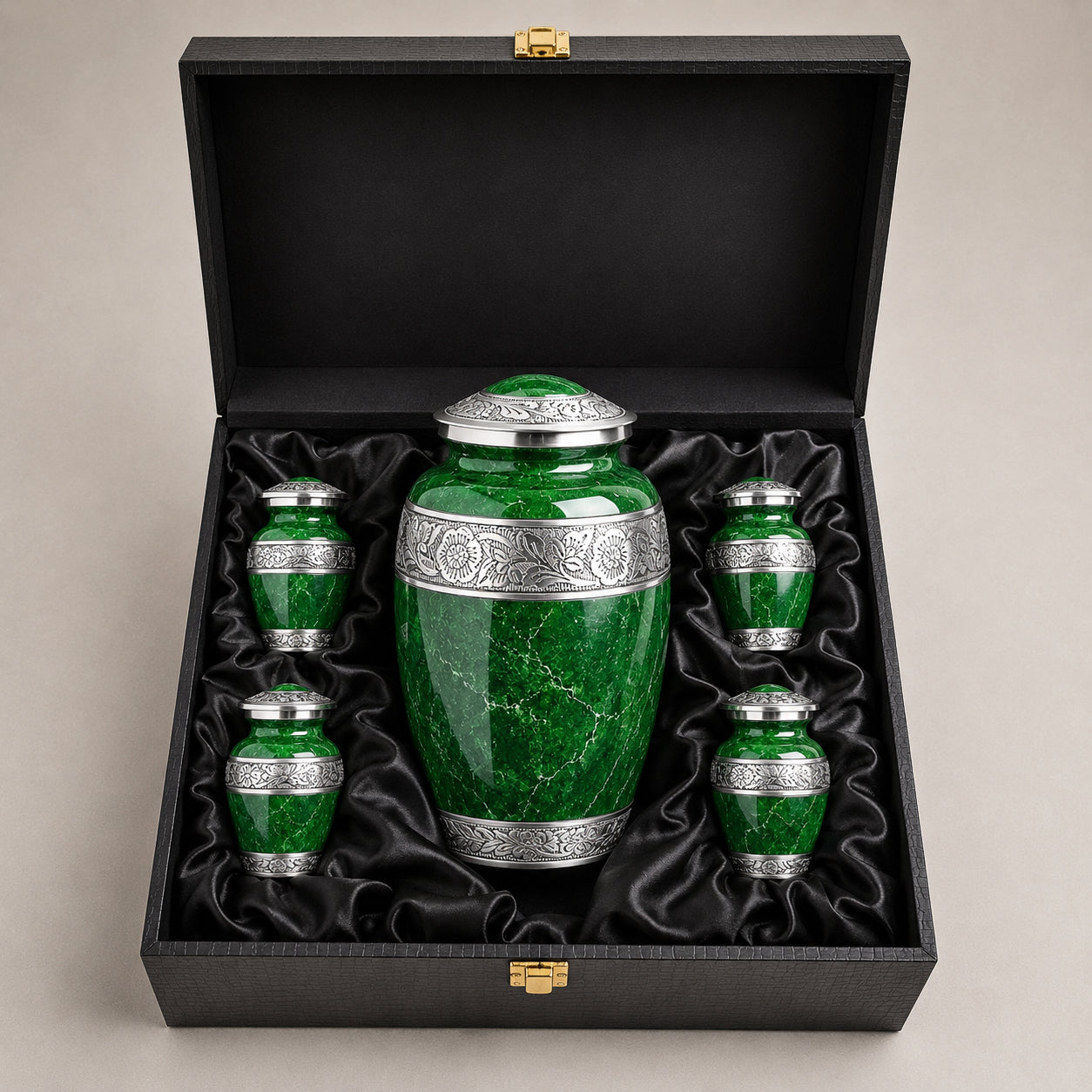 Green marble cremation urn set displayed in elegant satin-lined storage case