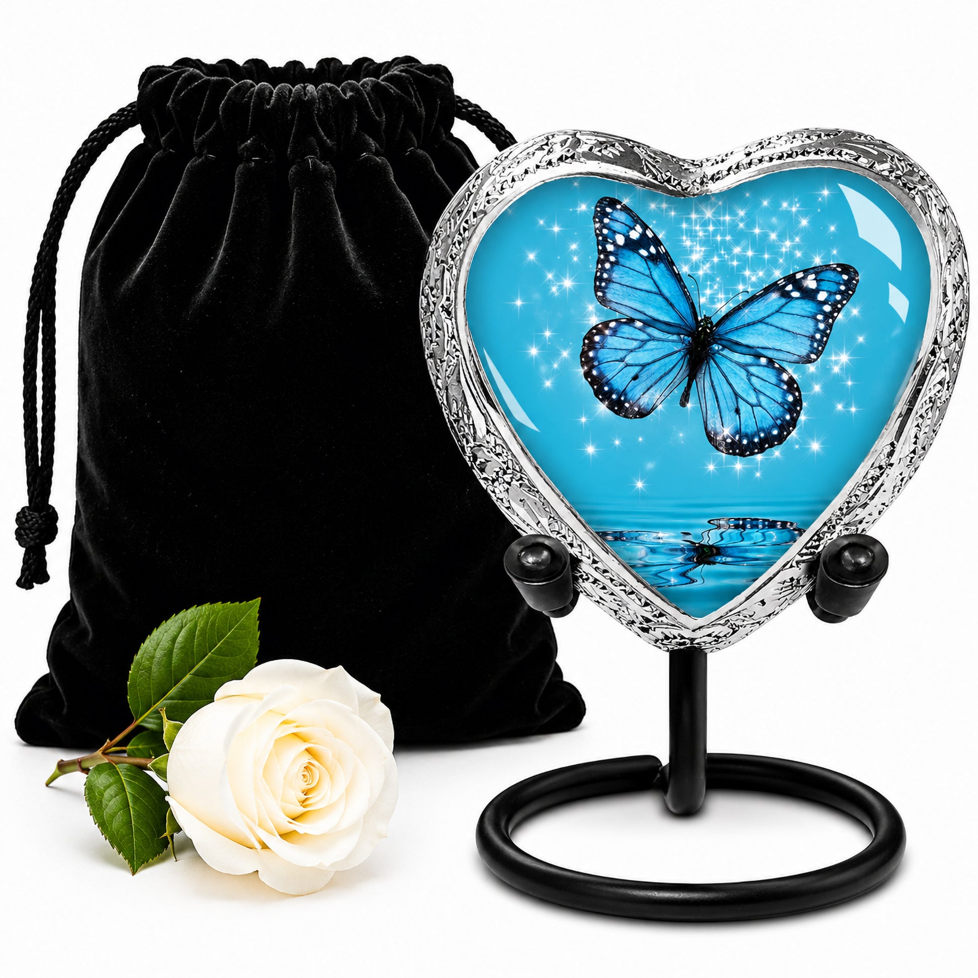 Light Blue Butterfly Heart Keepsake Cremation Urn on display stand with black velvet bag and white rose — small sharing memorial urn for human ashes