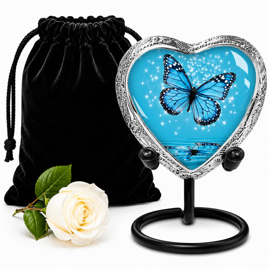 Light Blue Butterfly Heart Keepsake Cremation Urn on display stand with black velvet bag and white rose — small sharing memorial urn for human ashes