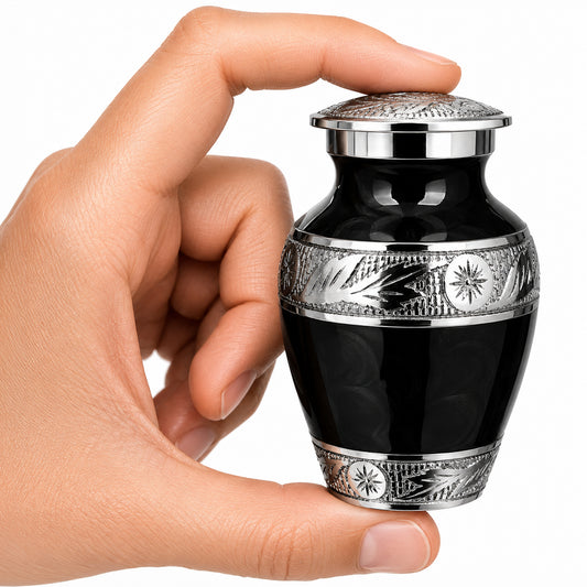 Black Forever After small keepsake cremation urn held in hand