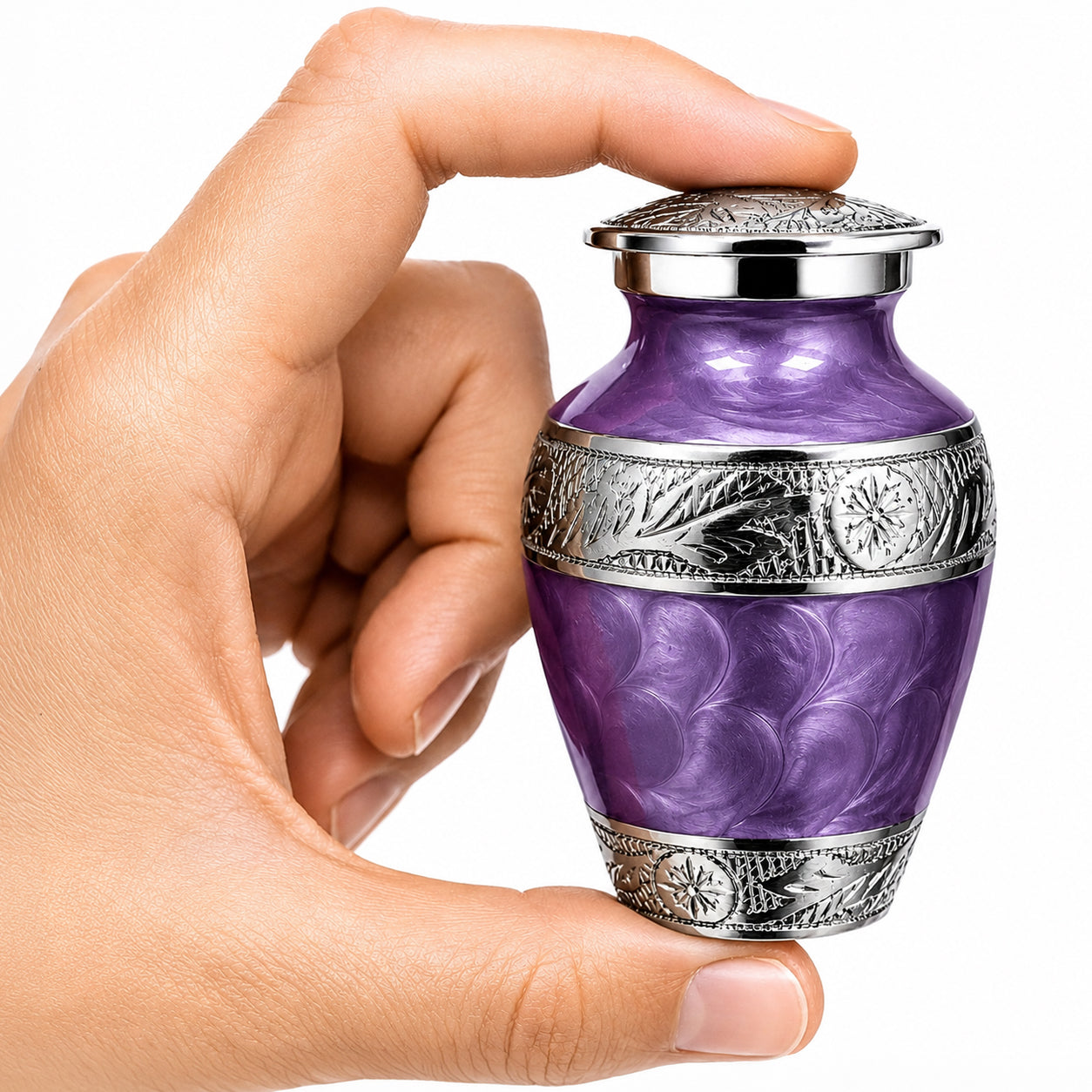 Purple Forever After small keepsake cremation urn held in hand