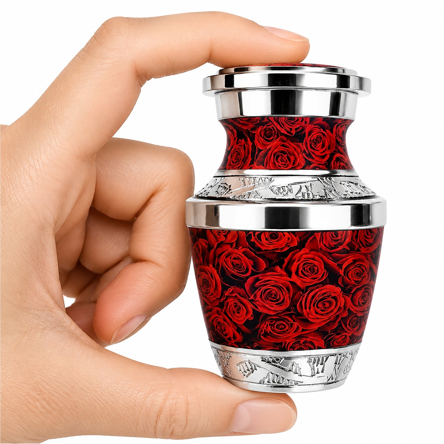 Red Roses Keepsake Cremation Urn held in hand with black velvet bag — small sharing memorial urn for human ashes