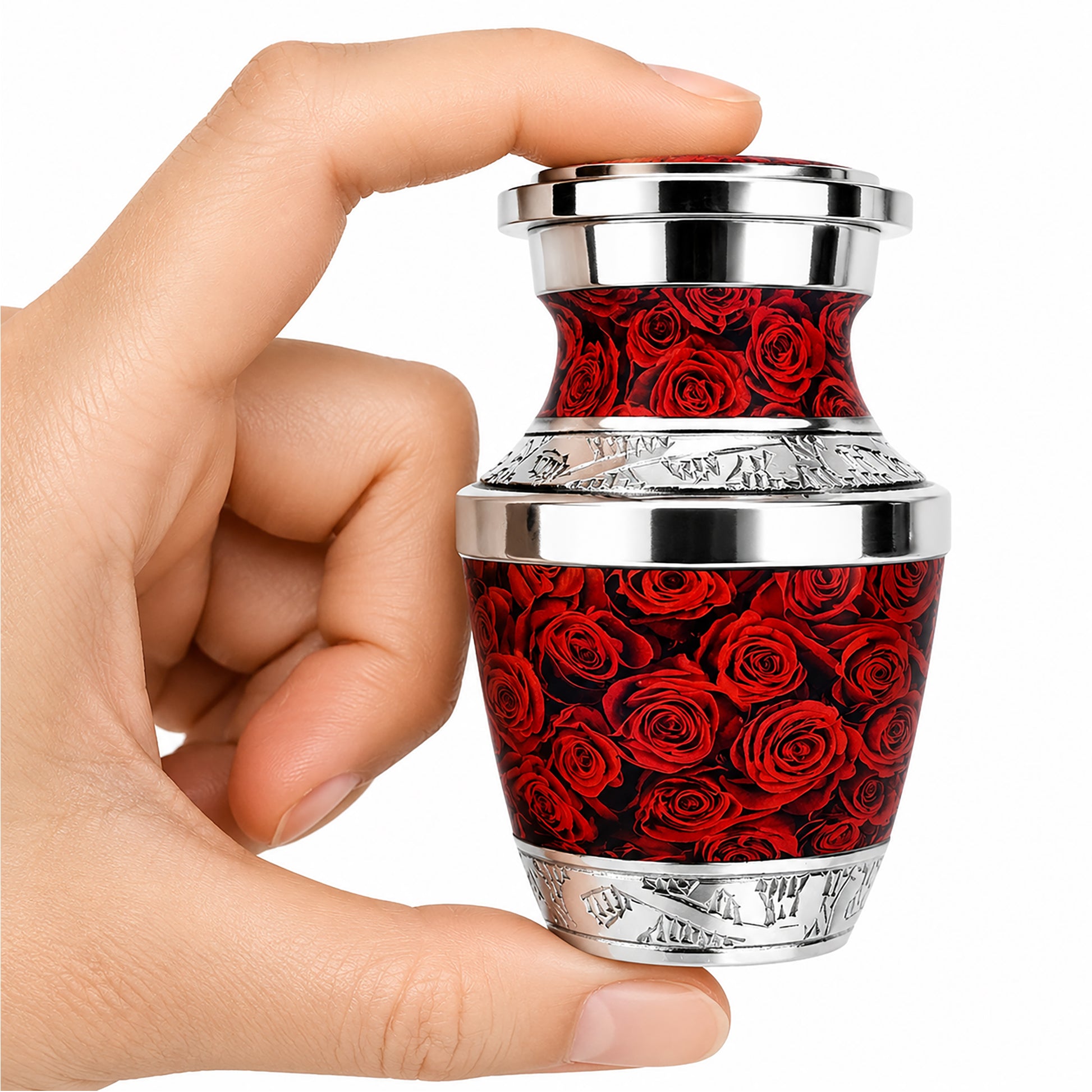 Red Roses Keepsake Cremation Urn held in hand with black velvet bag — small sharing memorial urn for human ashes