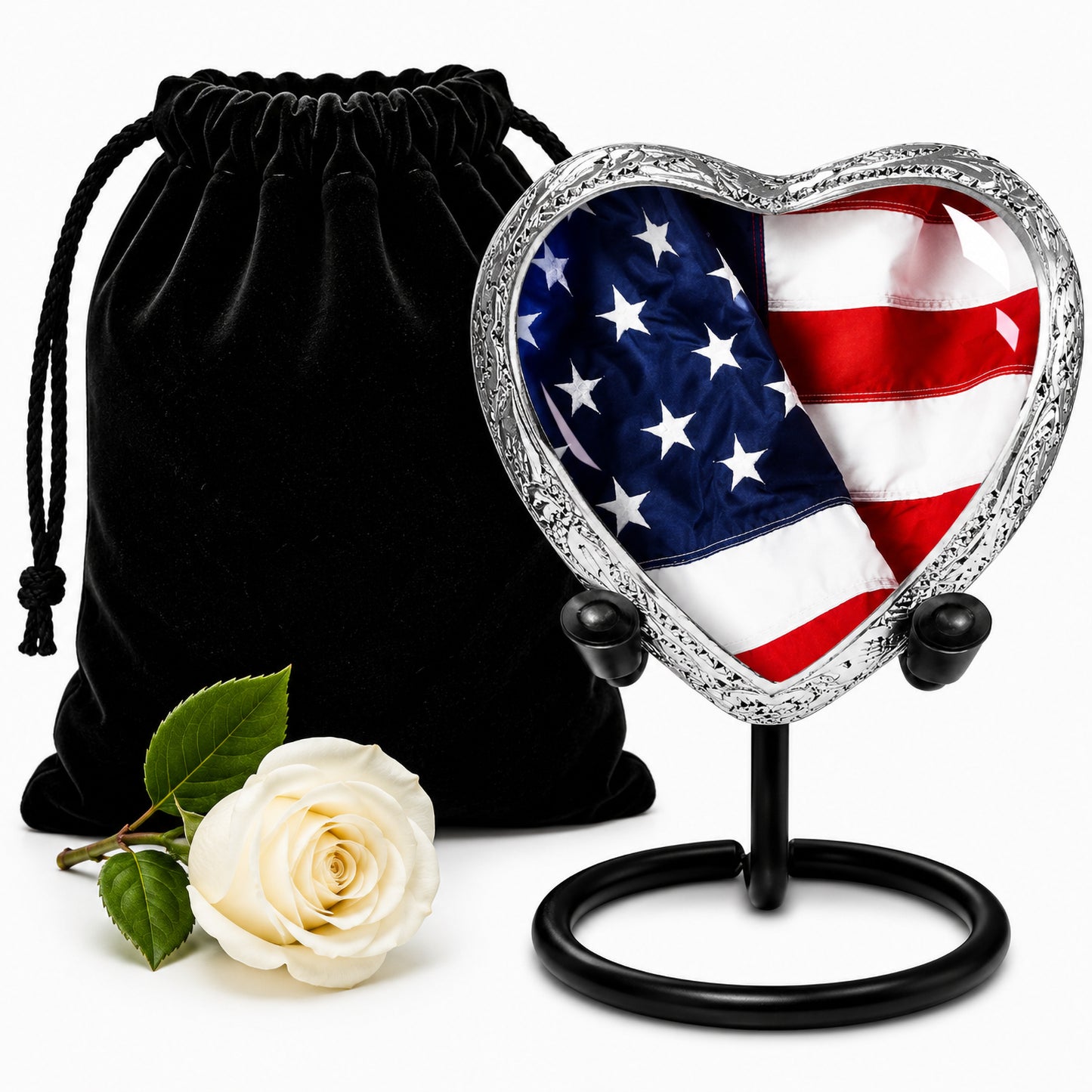 American Flag Heart Keepsake Cremation Urn on display stand with black velvet bag and white rose — small patriotic memorial urn
