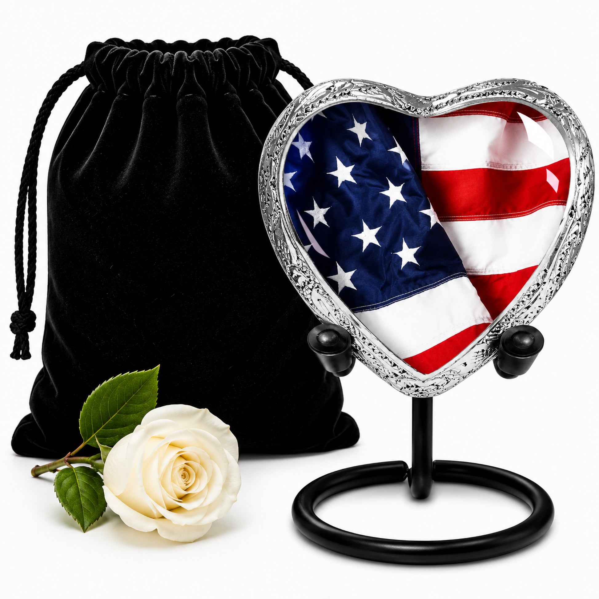 American Flag Heart Keepsake Cremation Urn on display stand with black velvet bag and white rose — small patriotic memorial urn