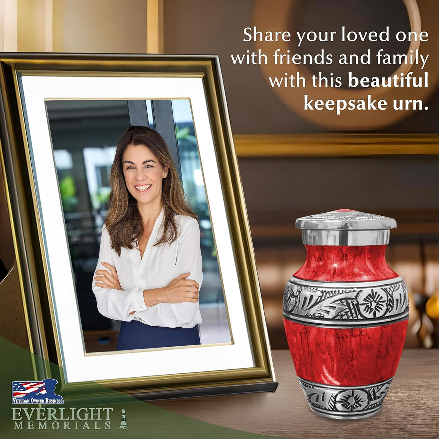 Red watercolor keepsake urn beside framed photo of woman on memorial table